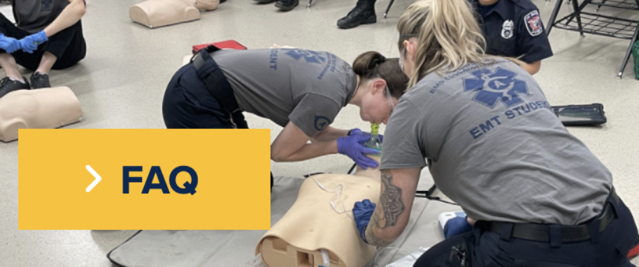 Students performing cpr on manikin